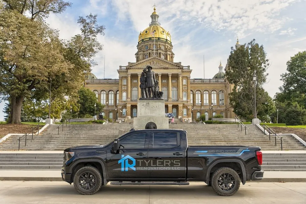 Tyler's Renovations company truck parked in front of the Iowa State Capitol